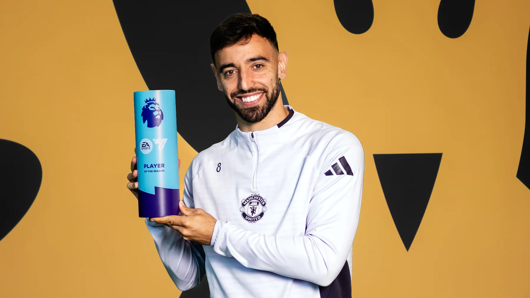 Bruno Fernandes holding the 2025/26 EA SPORTS Premier League Player of the Season award
